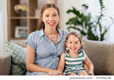 pregnant mother and daughter at home pregnant mother and daughter at home 45498286
