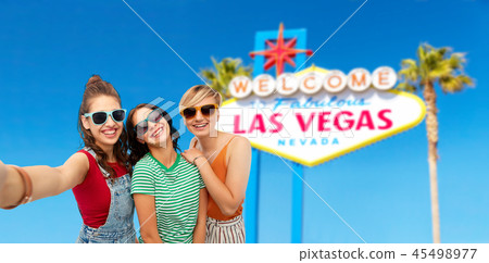female friends taking selfie over las vegas sign female friends taking selfie over las vegas sign 45498977