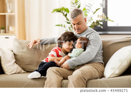 happy father with preteen and baby son at home 45499271