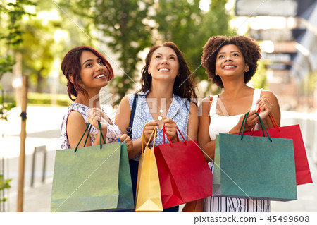 happy women with shopping bags in city happy women with shopping bags in city 45499608