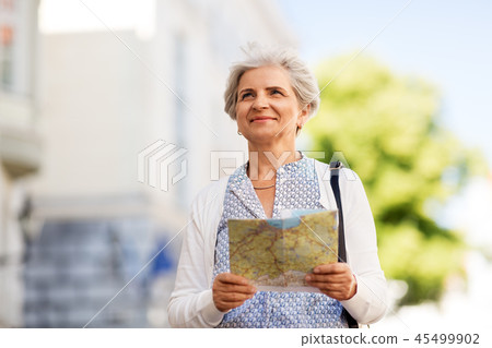 senior woman or tourist with map on city street 45499902