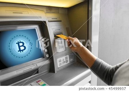 close up of woman inserting card to atm machine 45499937