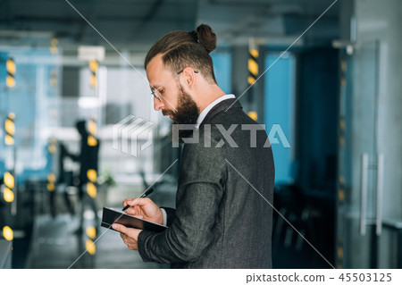 business man writing notebook memos data analysis business man writing notebook memos data analysis 45503125