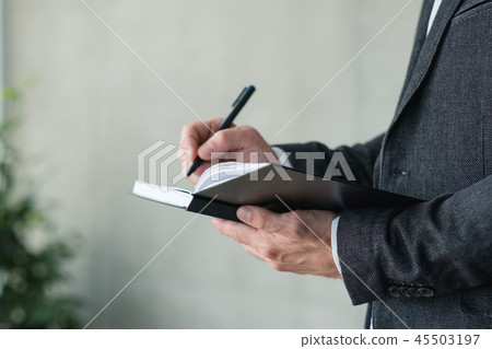 man hand writing notebook business planning agenda man hand writing notebook business planning agenda 45503197
