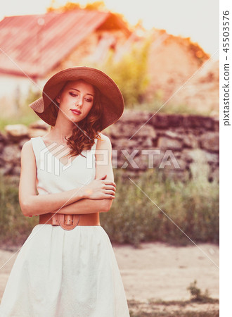 girl in hat and white dress at countryside girl in hat and white dress at countryside 45503576