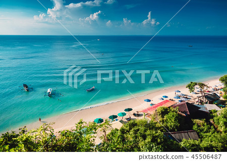 Tropical beach with boats and blue ocean in tropic Tropical beach with boats and blue ocean in tropic 45506487