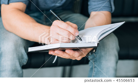 man hand writing notebook plan goals visualization 45506653