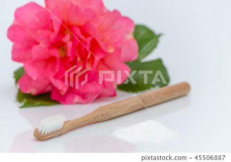 no plastic, wood toothbrush and xylitol, birch sugar, rose on white 45506887