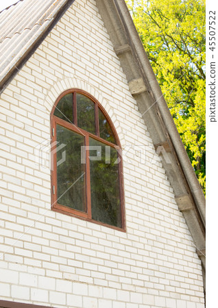 facade of the house of brick brown attic with a wi facade of the house of brick brown attic with a wi 45507522
