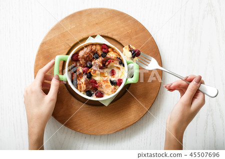 Top view casserole baked cherry and raspberries 45507696