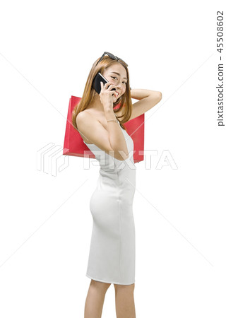 Attractive asian woman holding shopping bags Attractive asian woman holding shopping bags 45508602