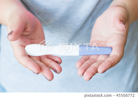 pregnancy test woman hand result conceiving child pregnancy test woman hand result conceiving child 45508772