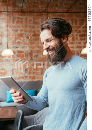 man holding tablet online mobility digital device 45508804