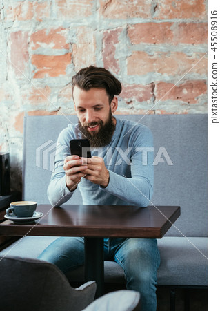 man mobile phone reading blogging idle lifestyle man mobile phone reading blogging idle lifestyle 45508916