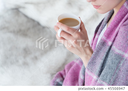woman blanket hold coffee mug drink hot beverage woman blanket hold coffee mug drink hot beverage 45508947