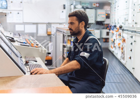 Marine engineer officer working in engine room Marine engineer officer working in engine room 45509036