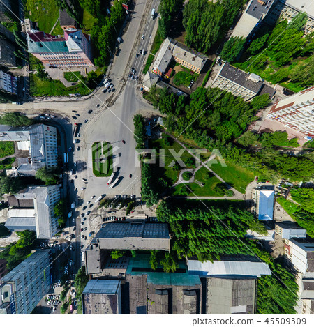 Aerial city view with crossroads and roads, houses buildings. Copter shot. Panoramic image. Aerial city view with crossroads and roads, houses buildings. Copter shot. Panoramic image. 45509309