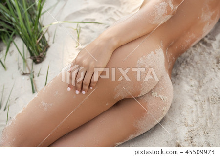 Summer vacation. Sexy female buttocks on the beach. Summer vacation. Sexy female buttocks on the beach. 45509973