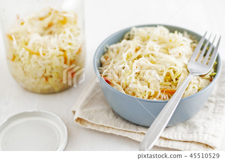 Jar and bowl with sauerkraut 45510529