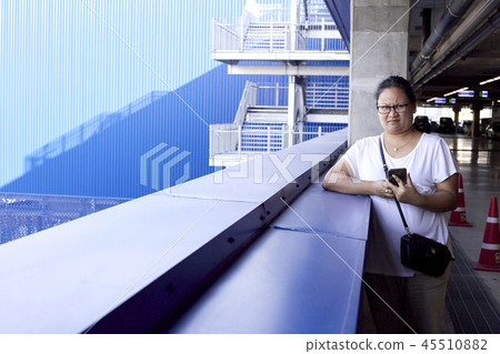 Woman using mobile phone to take photo Woman using mobile phone to take photo 45510882