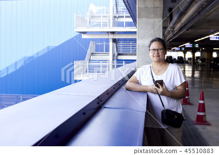 Woman using mobile phone to take photo Woman using mobile phone to take photo 45510883