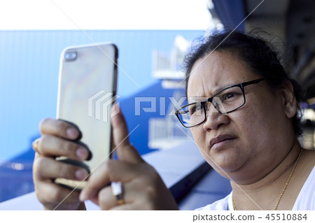 Woman using mobile phone to take photo Woman using mobile phone to take photo 45510884