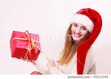 Woman opening gift box. Christmas time Woman opening gift box. Christmas time 45511345