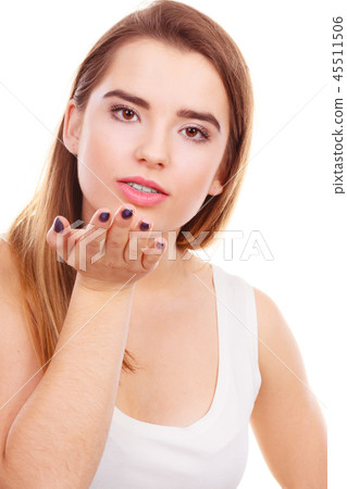 Teenager woman sending air kisses, love gesture 45511506