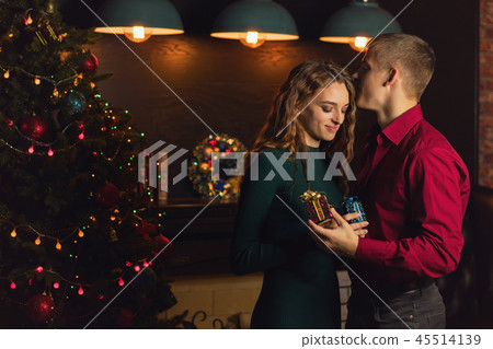 A loving couple celebrates Christmas 45514139