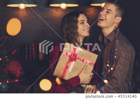 A loving couple celebrates Christmas A loving couple celebrates Christmas 45514140