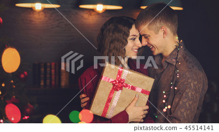 A loving couple celebrates Christmas A loving couple celebrates Christmas 45514141