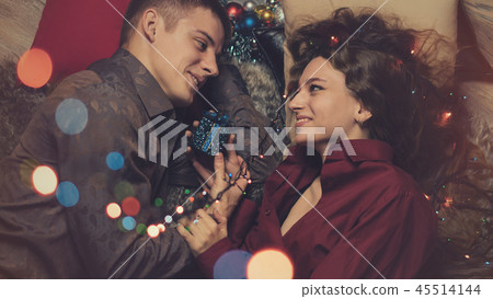 Couple in love celebrating christmas Couple in love celebrating christmas 45514144
