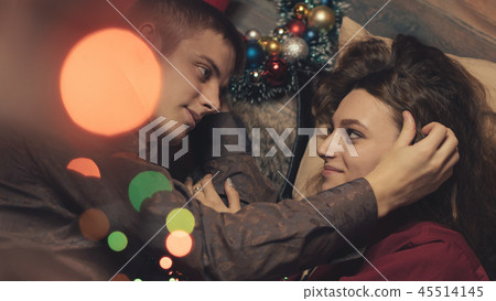 Couple in love celebrating christmas Couple in love celebrating christmas 45514145