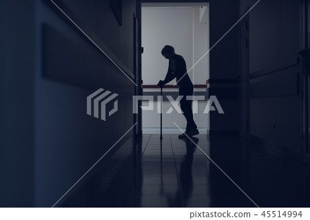 Woman is moving with cane in corridor Woman is moving with cane in corridor 45514994