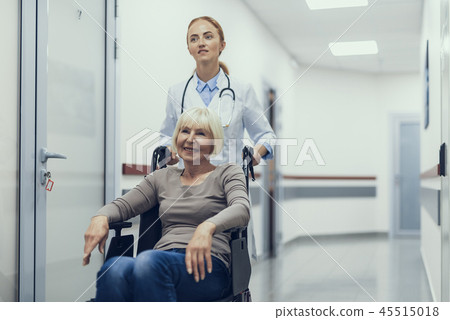 Doctor is helping invalid lady in the hospital Doctor is helping invalid lady in the hospital 45515018