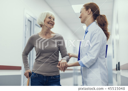 Jolly physician is enjoying conversation with patient 45515048