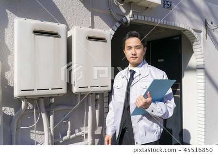 Businessman checking the old water heater 45516850