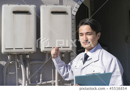 Old water heater and businessman Please leave it! Guts pose Old water heater and businessman Please leave it! Guts pose 45516854