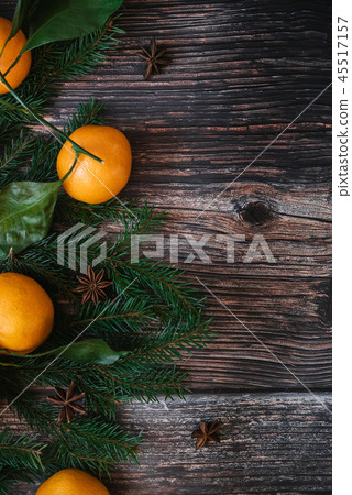 decorative Christmas frame of Mandarins, fir branches, star anise. Winter background with copy space 45517157