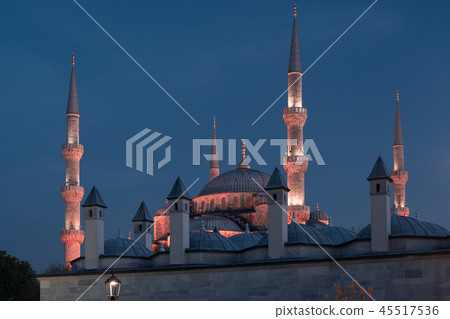 Blue Mosque at night with golden illumination, wide view of Istanbul in dusk. Sultanahmet Camii Blue Mosque at night with golden illumination, wide view of Istanbul in dusk. Sultanahmet Camii 45517536