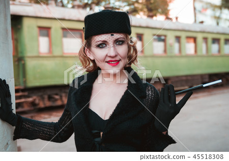 Retro woman on the train station Retro woman on the train station 45518308