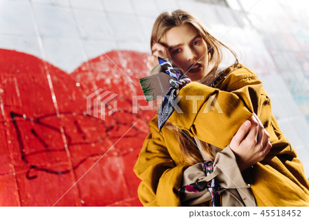 Famous appealing photo model with bright lips promoting eco fashion 45518452