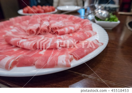 Hotpot beef rolls closeup on plate 45518453