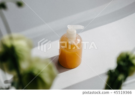 Clear plastic bottle with organic cosmetic Clear plastic bottle with organic cosmetic 45519366