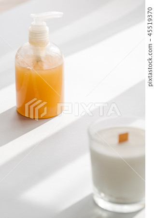Clear plastic bottle with organic cosmetics Clear plastic bottle with organic cosmetics 45519370
