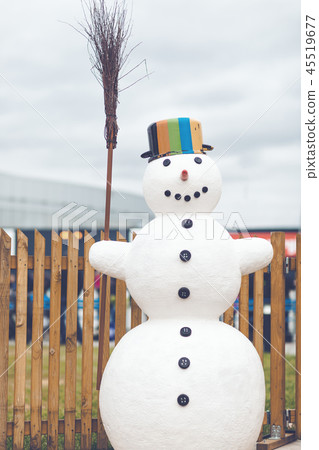 Snowman with a pot and a broomstick in his hand Snowman with a pot and a broomstick in his hand 45519677
