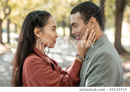 Charming international girl looking into male eyes 45519714