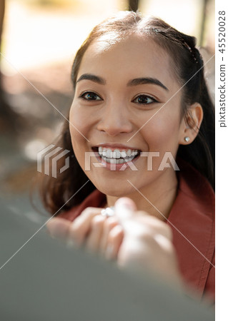 Close up of kind teenager that demonstrating her smile Close up of kind teenager that demonstrating her smile 45520028