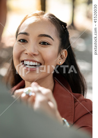 Portrait of delighted girl that staring at her partner Portrait of delighted girl that staring at her partner 45520030