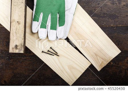 Work gloves on planks Work gloves on planks 45520430
